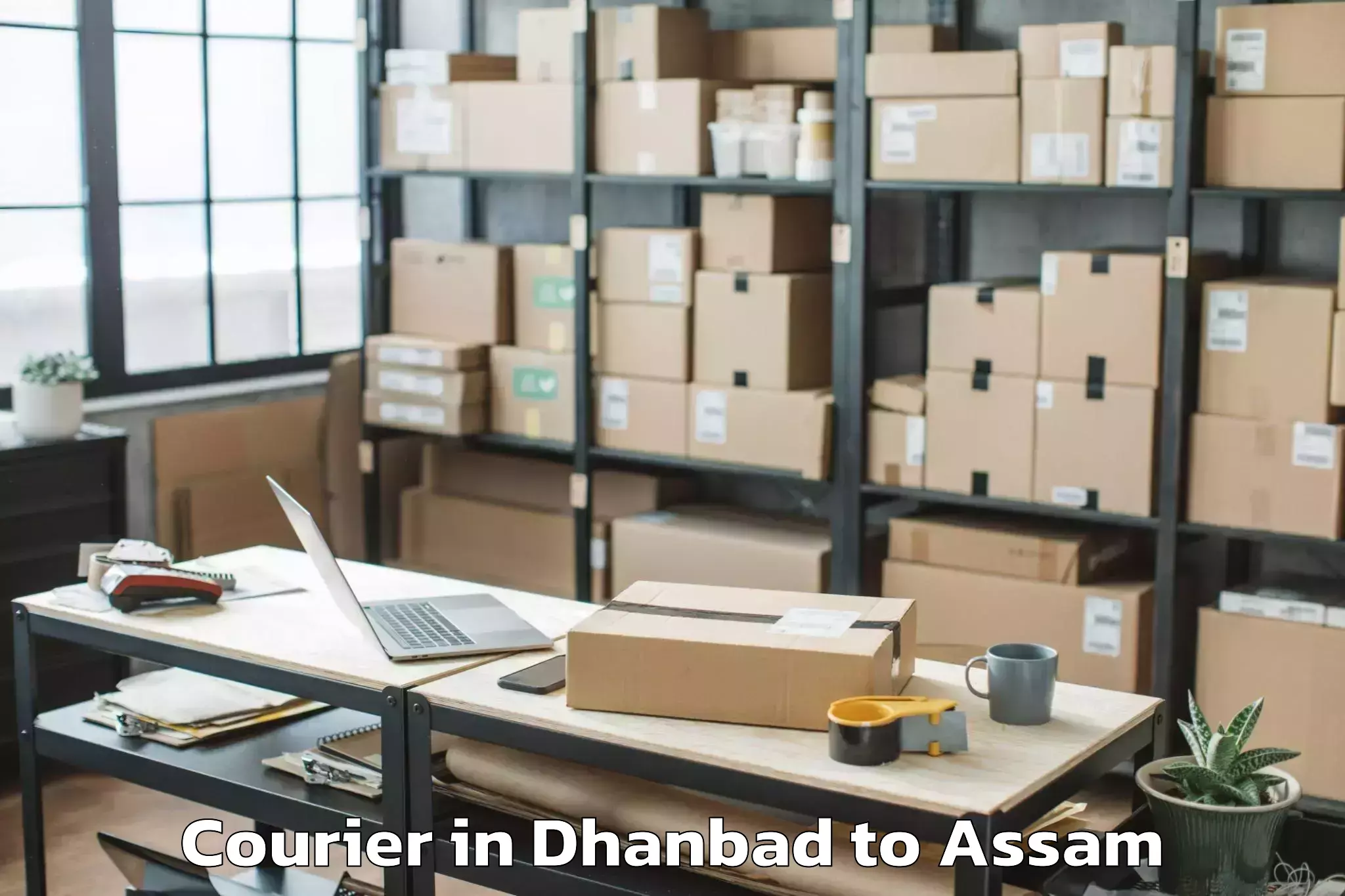 Easy Dhanbad to Tezpur University Courier Booking